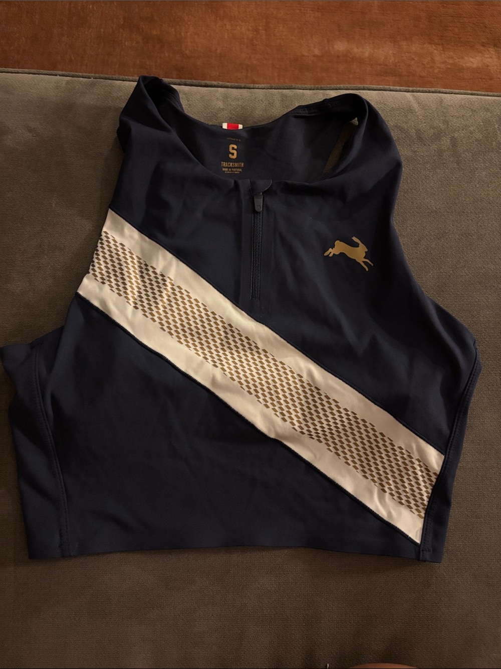 Tracksmith Navy Crop Top with Cream Diagonal Band and Gold Logo